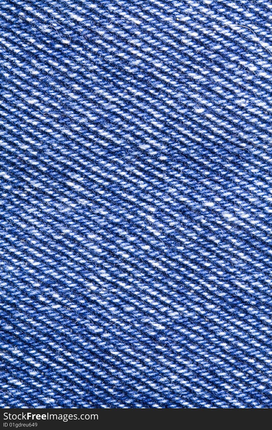 A close-up of the texture of blue jeans fabric. A close-up of the texture of blue jeans fabric