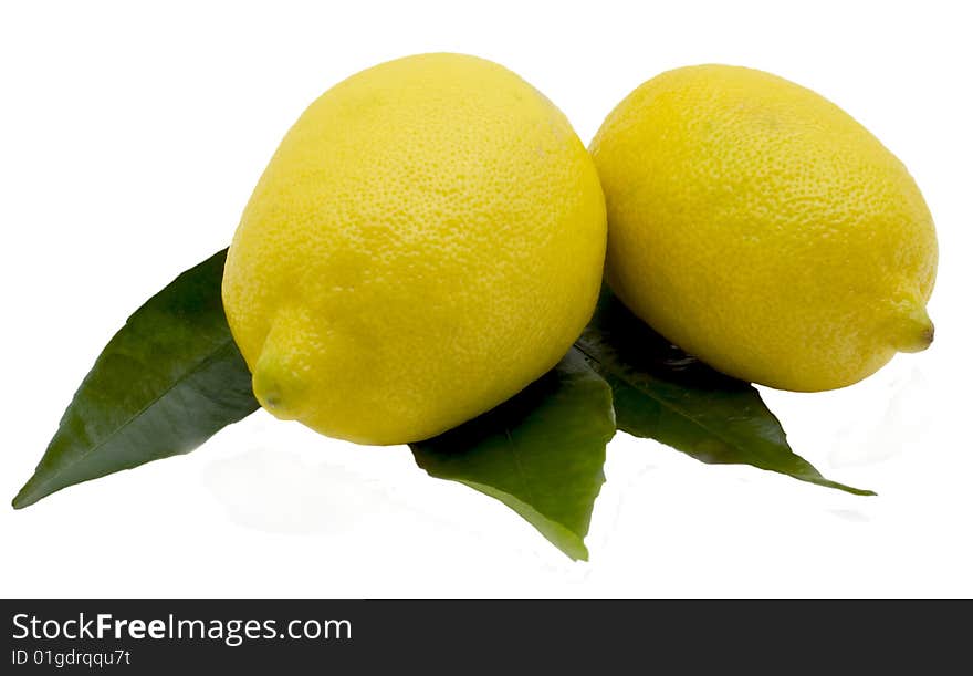 Lemons and green sheet isolated on the white