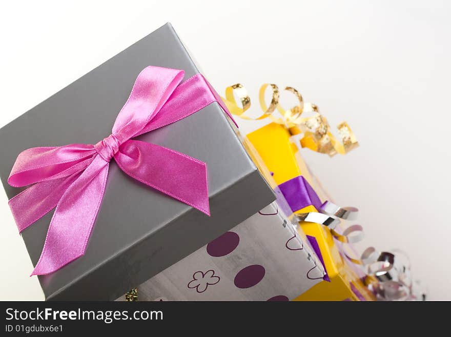 Various gift boxes on a white background, with bow and ribbon. Various gift boxes on a white background, with bow and ribbon