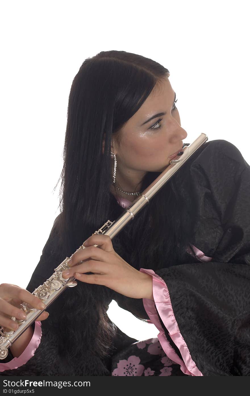 Portrait of a young woman in a black and pink dress with a flute. Portrait of a young woman in a black and pink dress with a flute