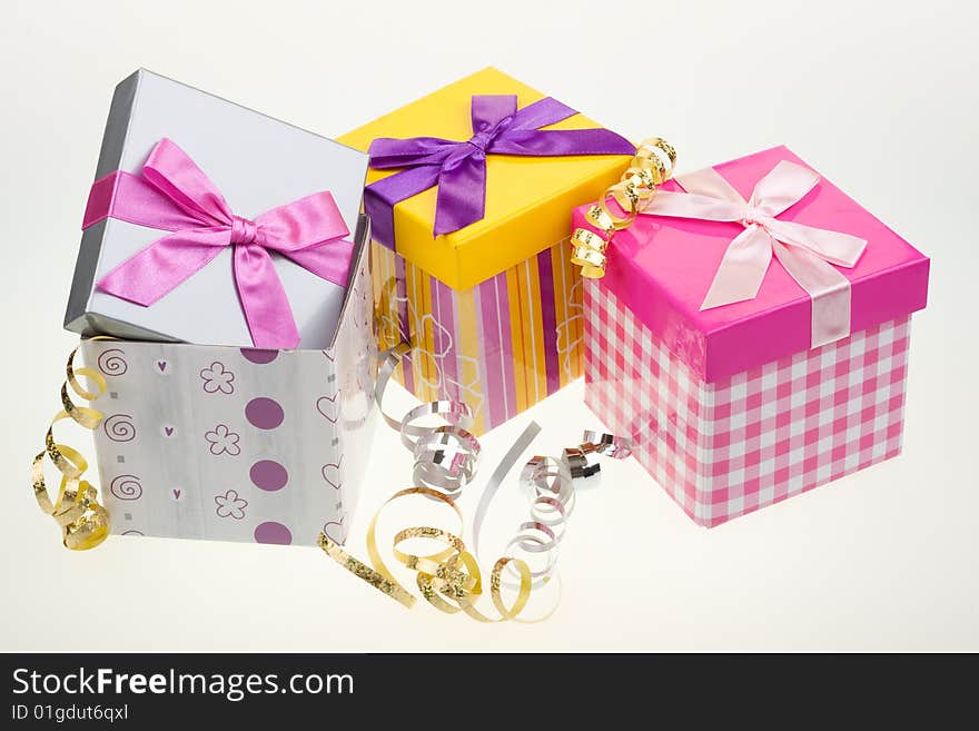 Various gift boxes on a white background, with bow and ribbon. Various gift boxes on a white background, with bow and ribbon