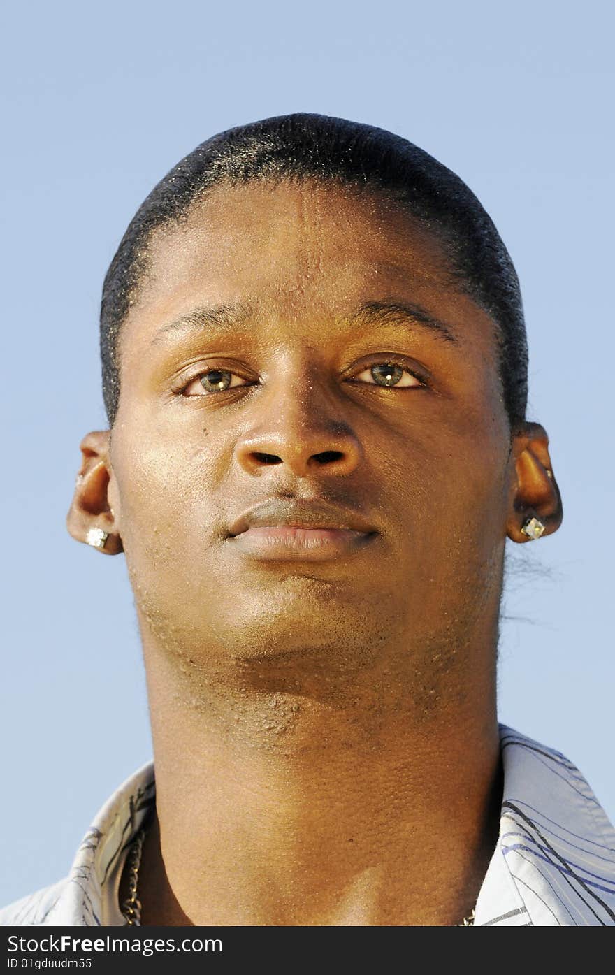 Young African American man isolated on a blue background