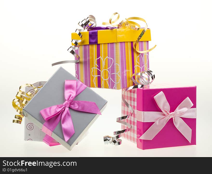 Various gift boxes on a white background, with bow and ribbon. Various gift boxes on a white background, with bow and ribbon