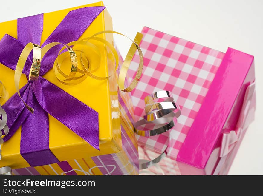 Various gift boxes on a white background, with bow and ribbon. Various gift boxes on a white background, with bow and ribbon