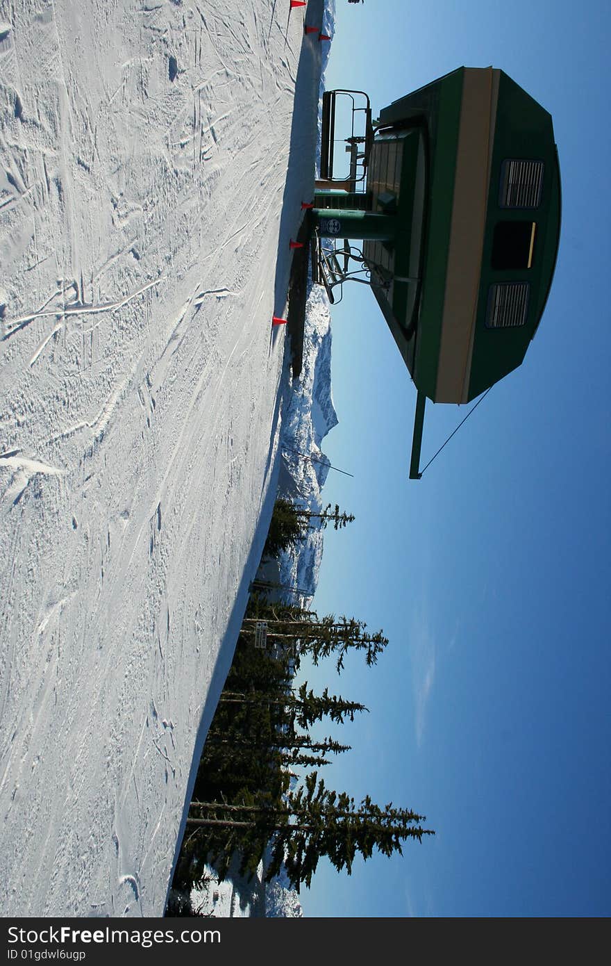 Ski lift ot the top of the mountain in a sunny day. Ski lift ot the top of the mountain in a sunny day