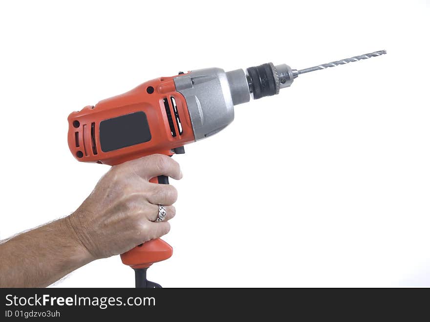 Male hand holding electric drill