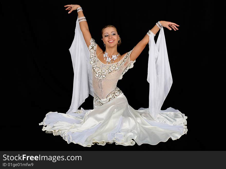 Blonde dancer in classical blue-white dress against black background. Blonde dancer in classical blue-white dress against black background