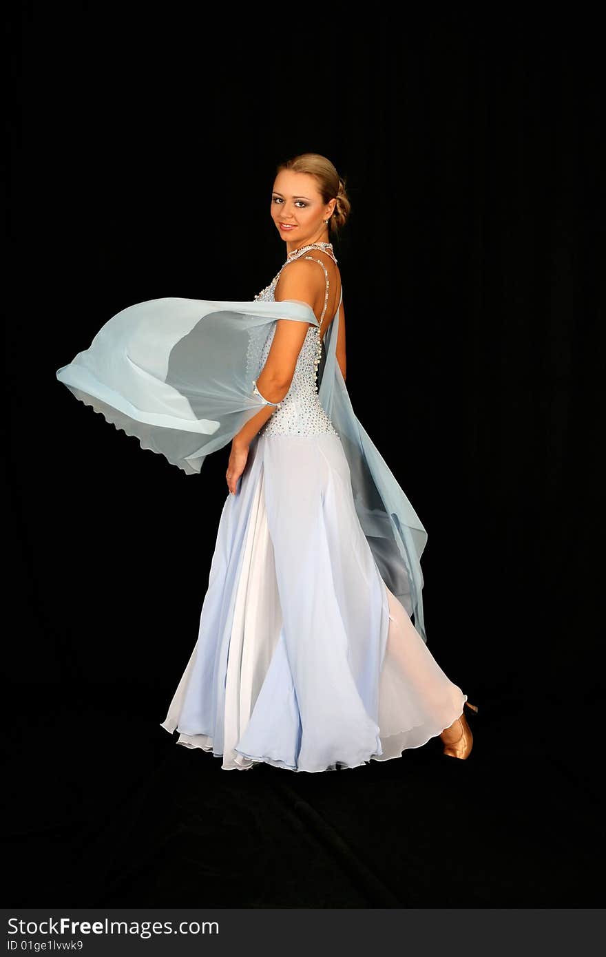 Girl in dance in classical blue-white dress