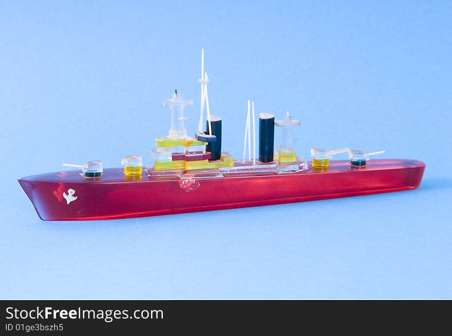 A red swimming ship on the sea. A red swimming ship on the sea