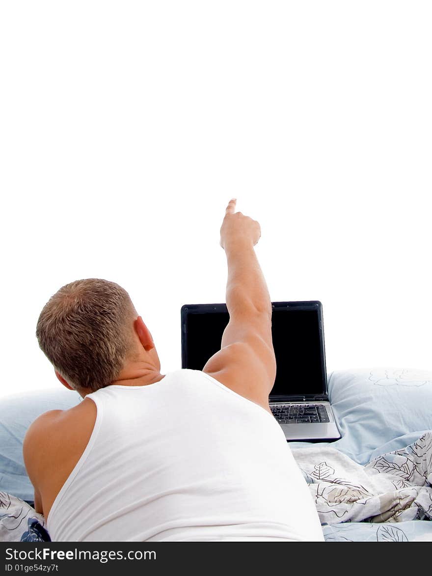 Laying indicating man with laptop on an isolated white background. Laying indicating man with laptop on an isolated white background