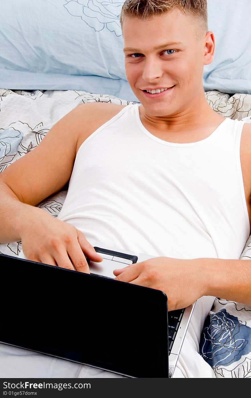 Man Working On Computer Pc In Bed