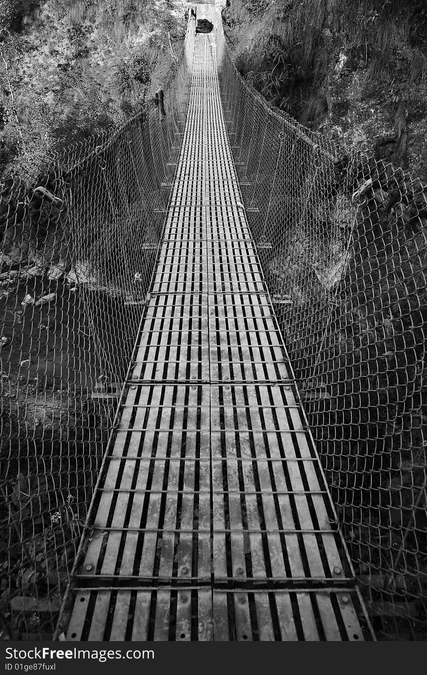 A photo of an old chain bridge in nepal