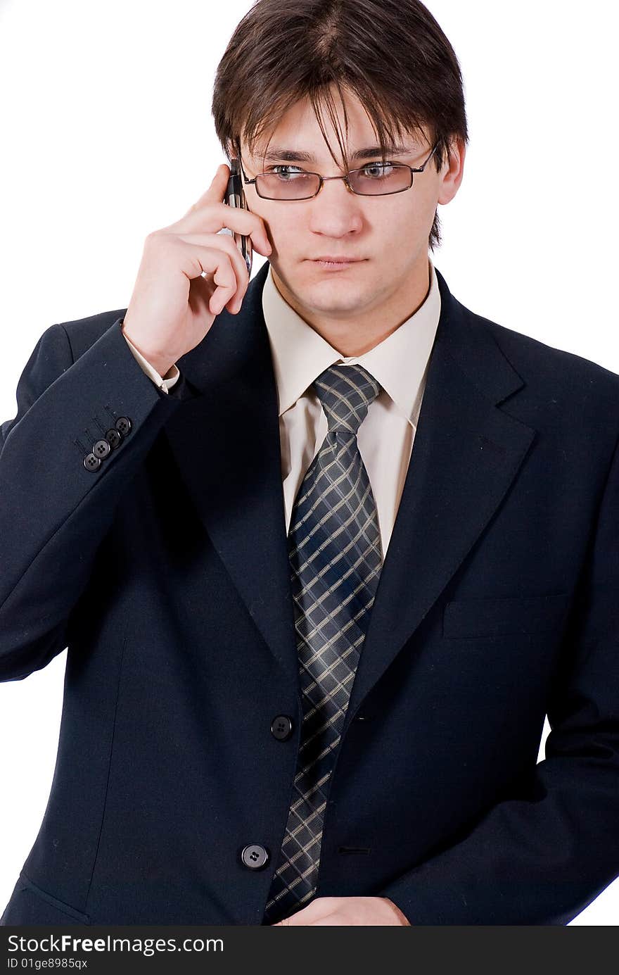 Young businessman calling by cellular phone. Over white