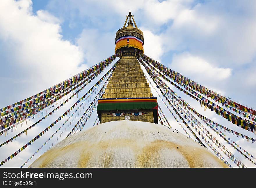 A huge buddhist stupa with colorful prayer flags in kathmandu.(nepal). A huge buddhist stupa with colorful prayer flags in kathmandu.(nepal)