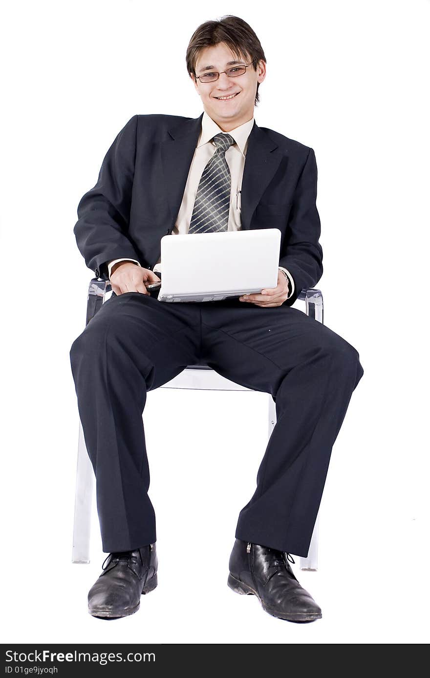 Businessman working on laptop computer, isolated on white background.