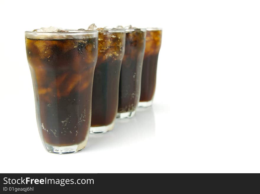 Glasses of cola isolated against a white background. Glasses of cola isolated against a white background