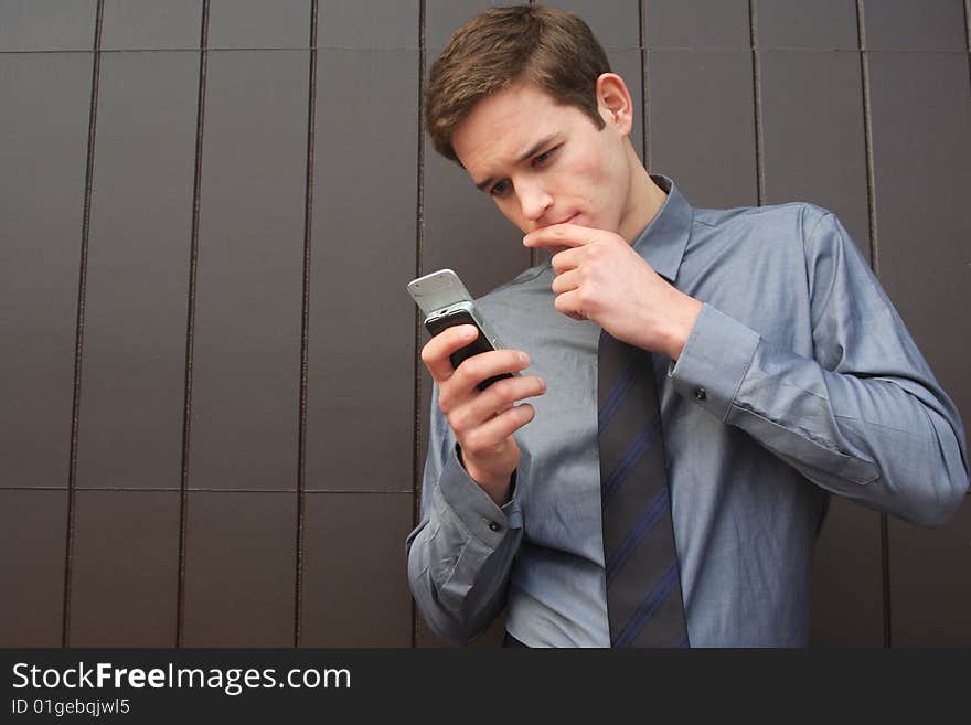 Businessman checking Messages on cell phone