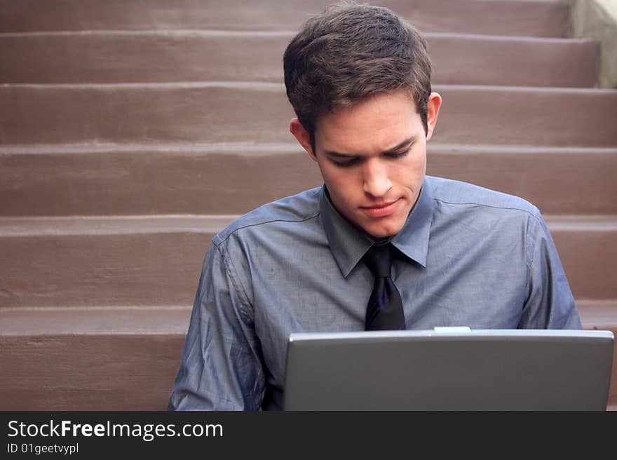 Businessman working on laptop checking messages