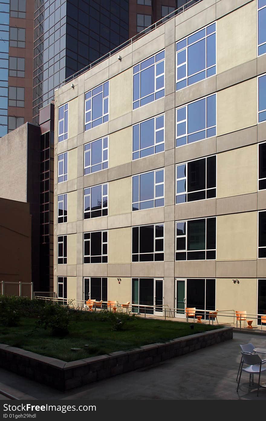 A modern loft courtyard with tables and chairs