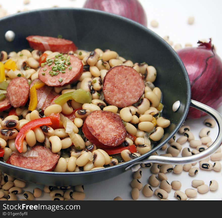 A fresh stew of beans and vegetables with sausage