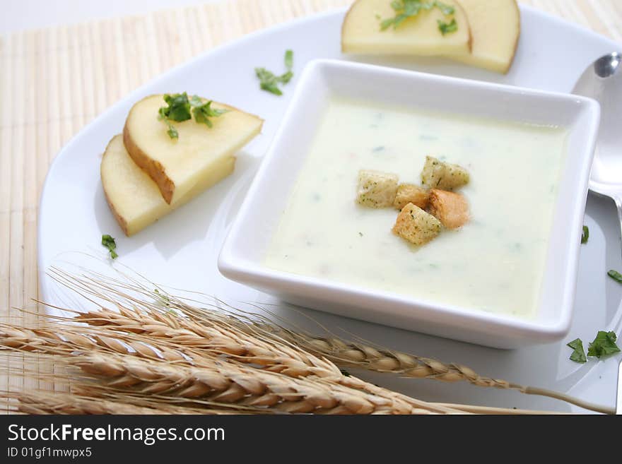 A fresh soup of potatoes with some croutons