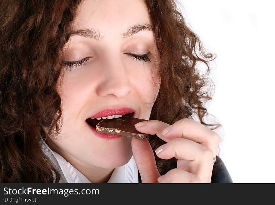 Lovely girl bite chocolate isolated on white