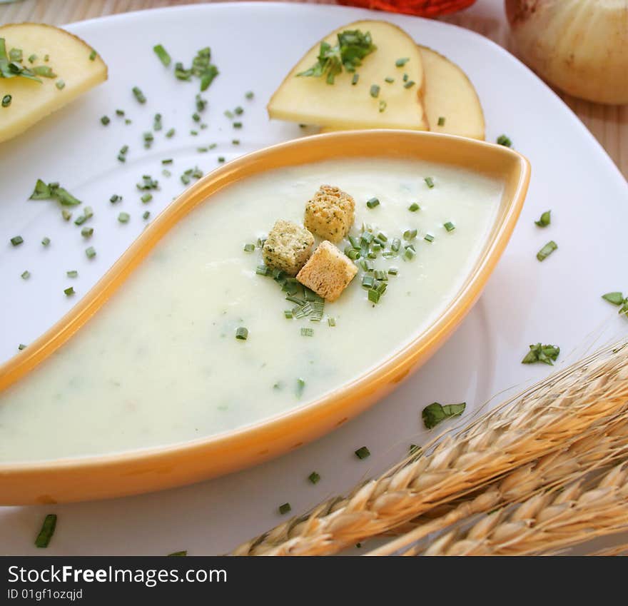 A fresh soup of potatoes with some croutons