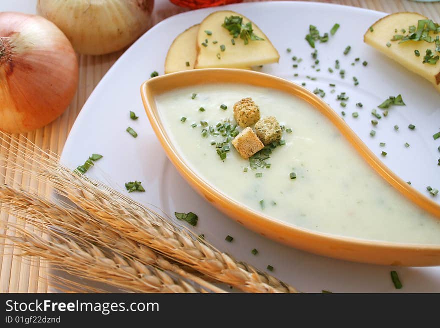 A fresh soup of potatoes with some croutons