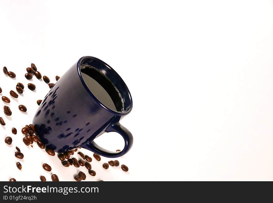 Isolated coffee with beans spread out. Isolated coffee with beans spread out