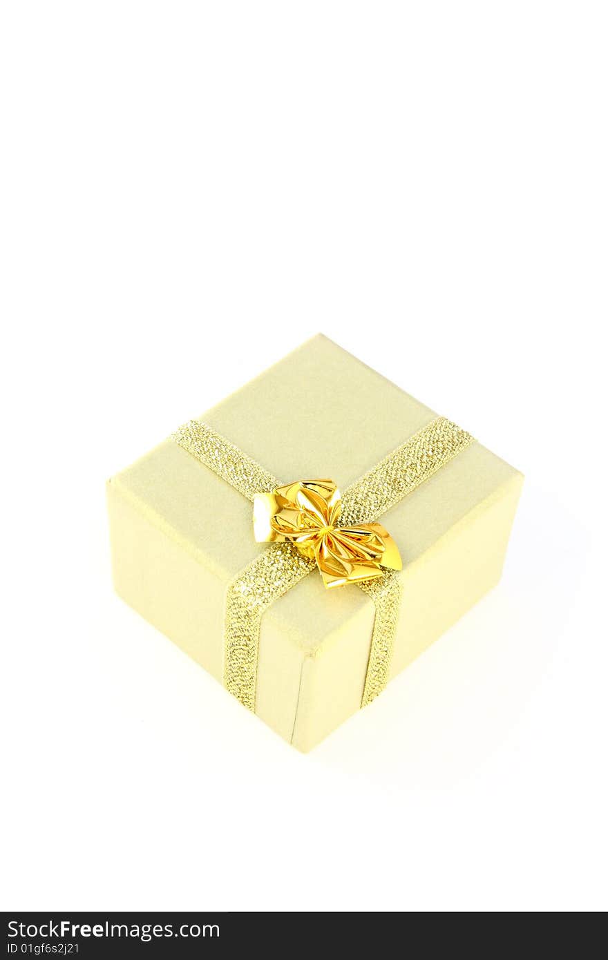 Gold color wrapped gift box witch bow