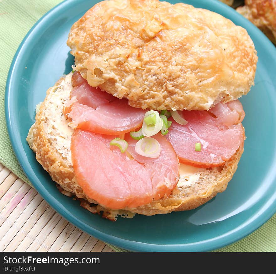 A fresh breakfast of a cheese-bread with turkey meat