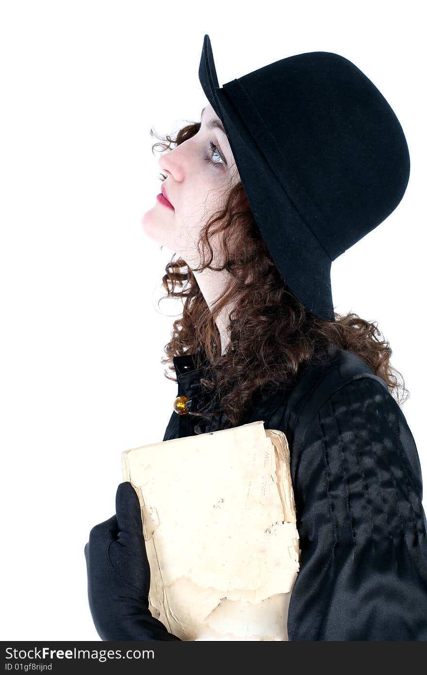 Girl in hat with old book isolated on white. Girl in hat with old book isolated on white