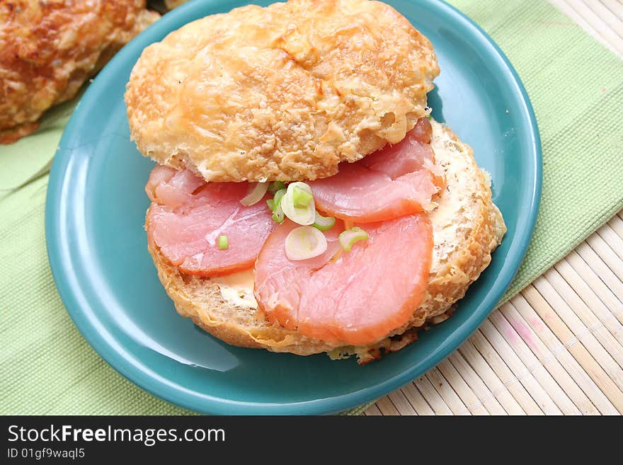 A fresh breakfast of a cheese-bread with turkey meat