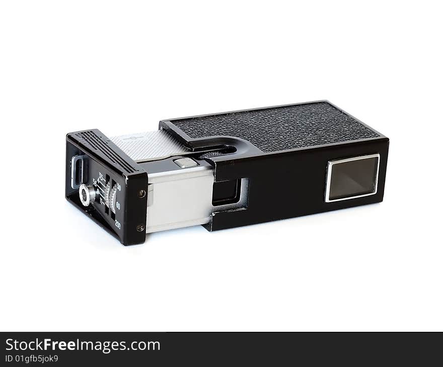 Shows an old film 16mm spy camera in black on a white background. Shows an old film 16mm spy camera in black on a white background