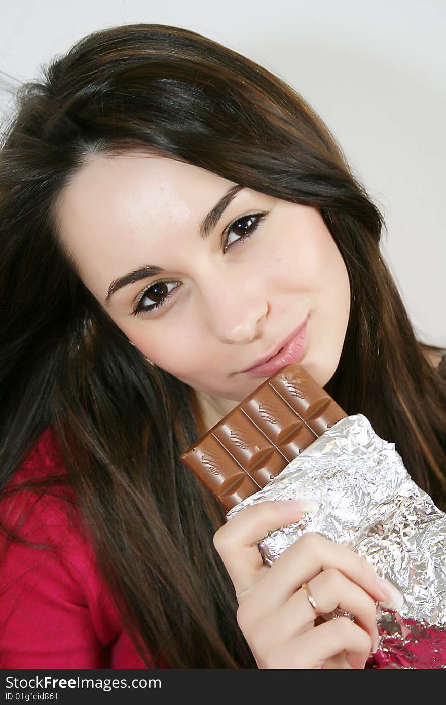 Woman eating a chocolate