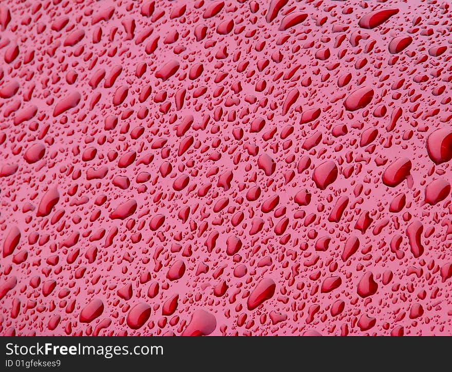 Water drops on red background