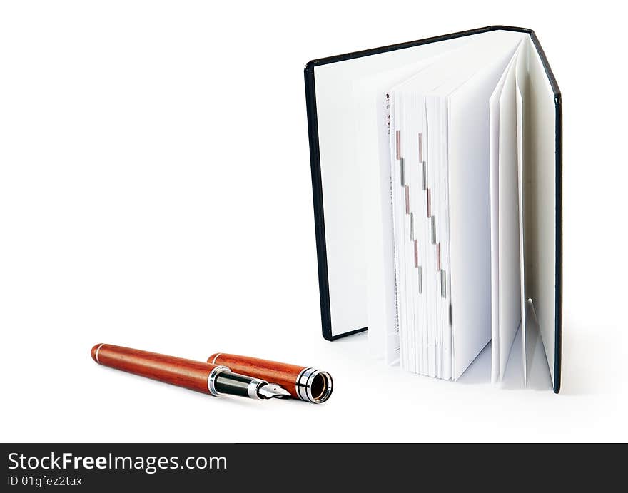 Notepad with   fountain pen  on white background. Notepad with   fountain pen  on white background