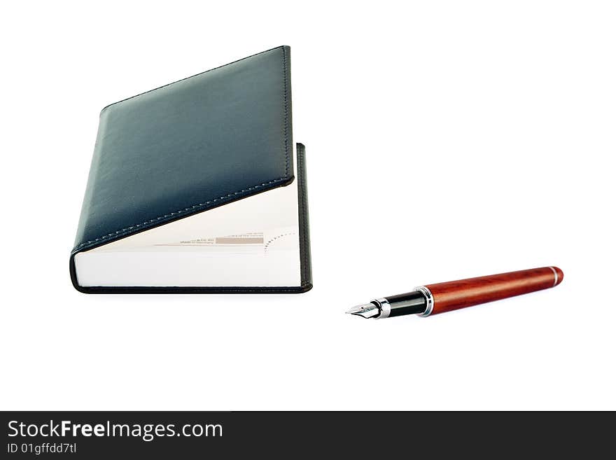 Notepad with  fountain pen  on white background. Notepad with  fountain pen  on white background