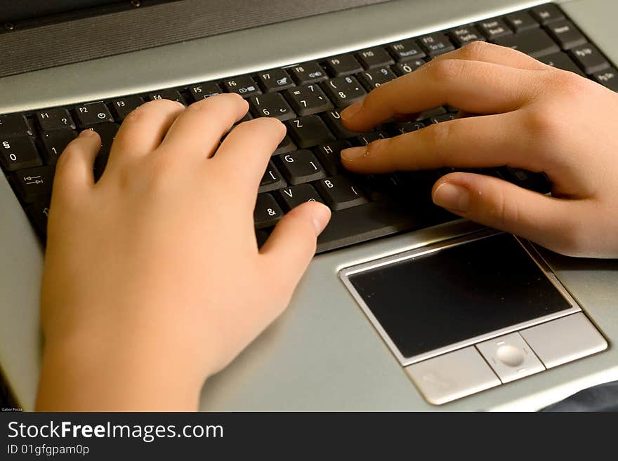 Hands on a laptop keyboard. Hands on a laptop keyboard