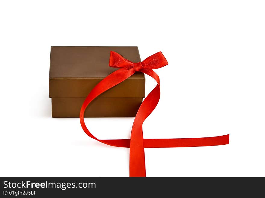 Gift box with red ribbon over a white background