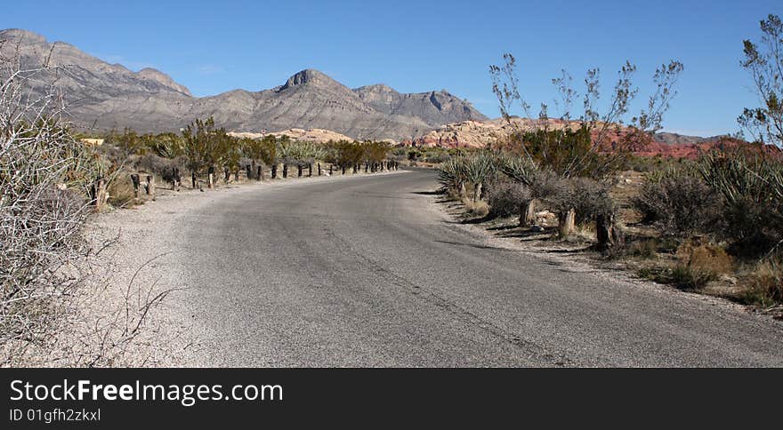 A Lone Stretch of Highway Winding Through the Desert. A Lone Stretch of Highway Winding Through the Desert