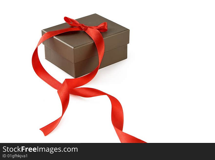 Gift box with red  ribbon over a white background