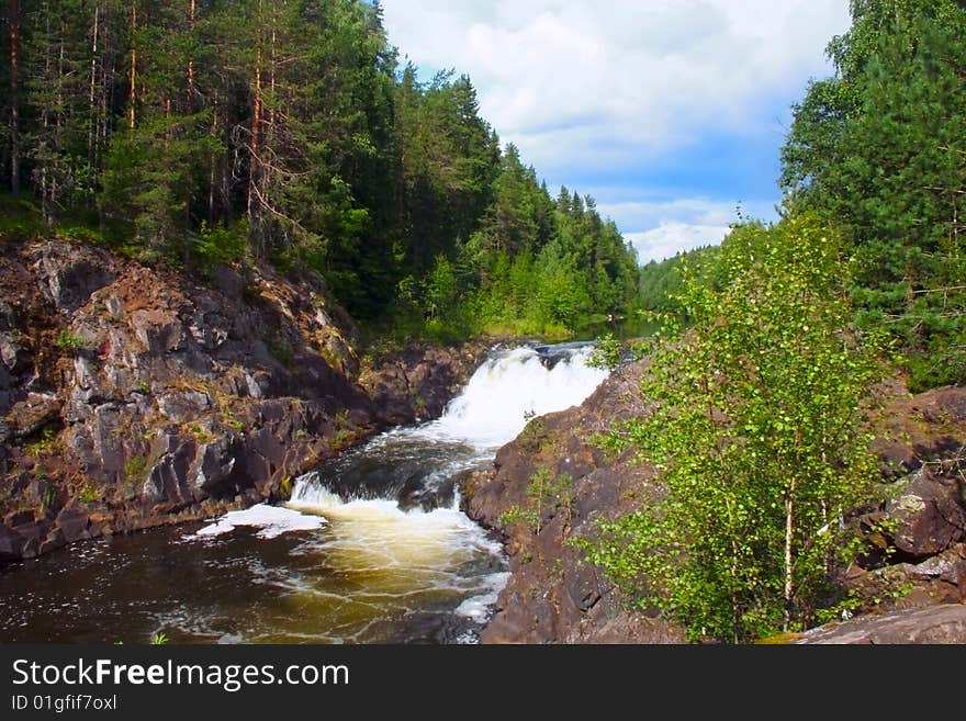 Summer kind on the well-known waterfall of Kivach to Kareliyas, a photo it is made in the afternoon in solar weather. Summer kind on the well-known waterfall of Kivach to Kareliyas, a photo it is made in the afternoon in solar weather