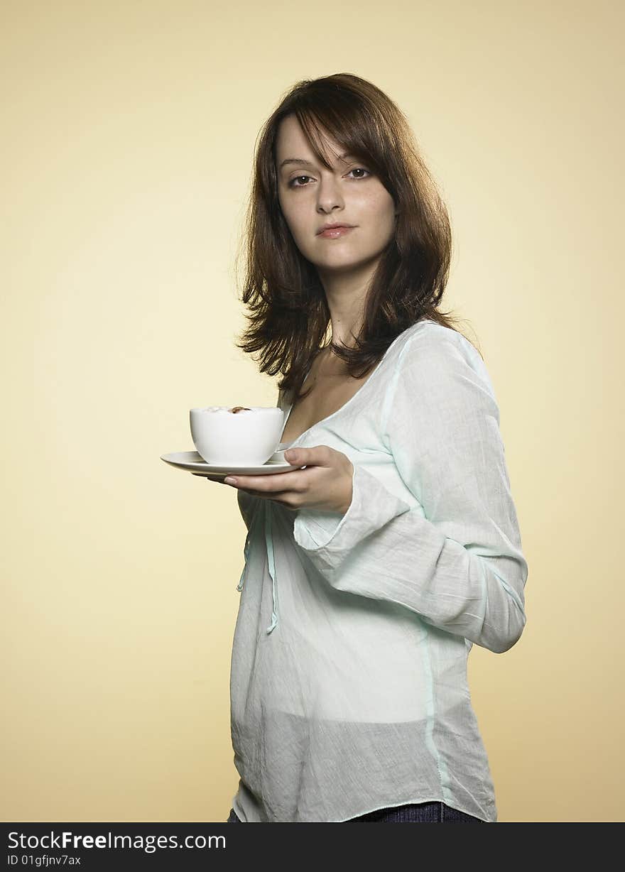 Laughing woman with long brown hair and a cup of coffee 01. Laughing woman with long brown hair and a cup of coffee 01