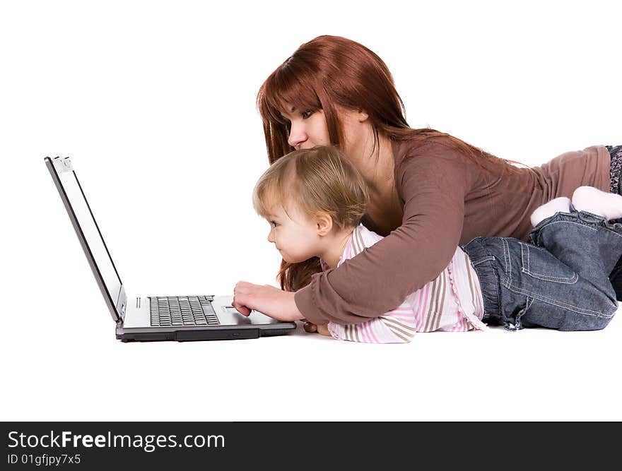 Mother and daughter playing on laptop. Mother and daughter playing on laptop