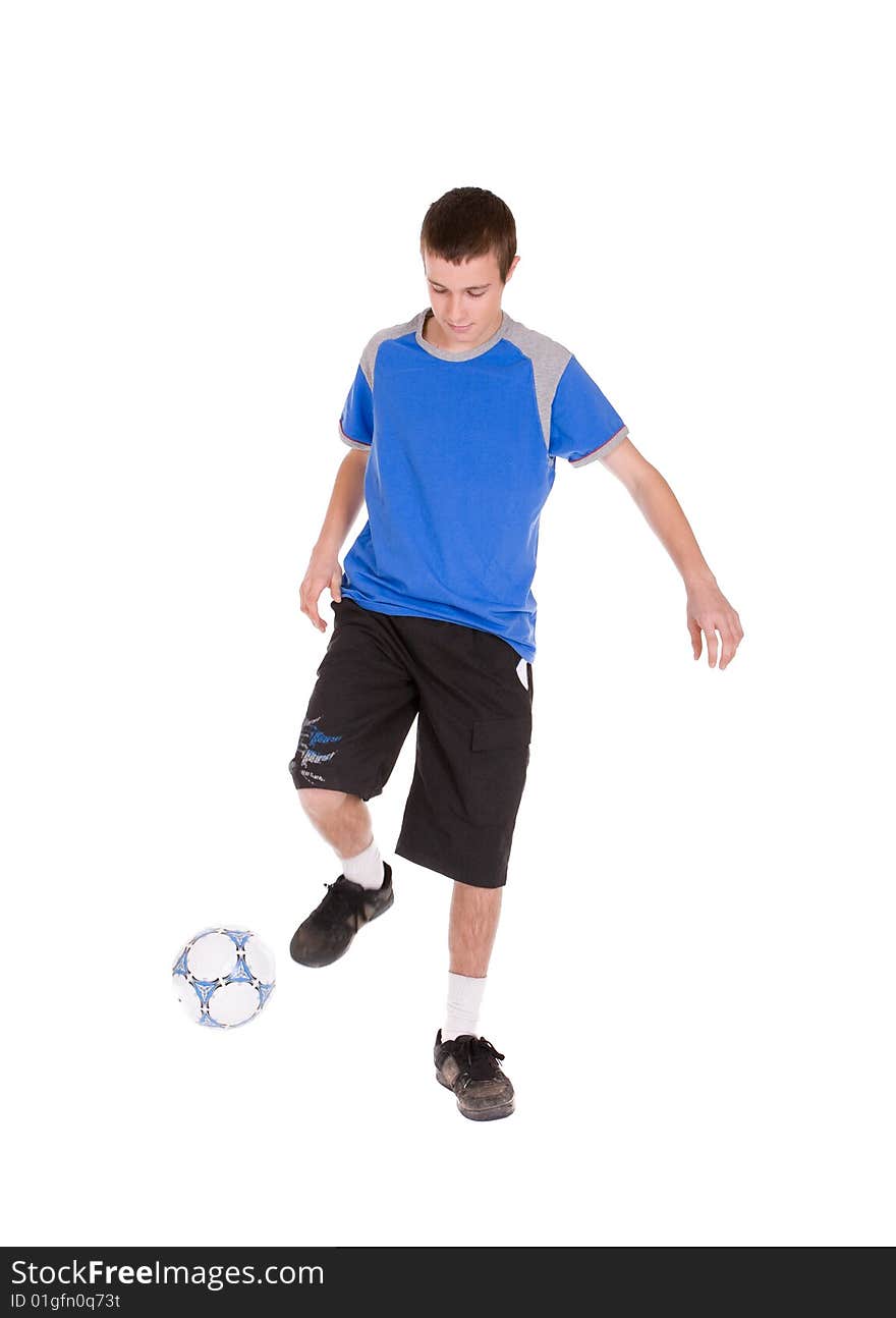 Happy teenager playing football. over white background. Happy teenager playing football. over white background