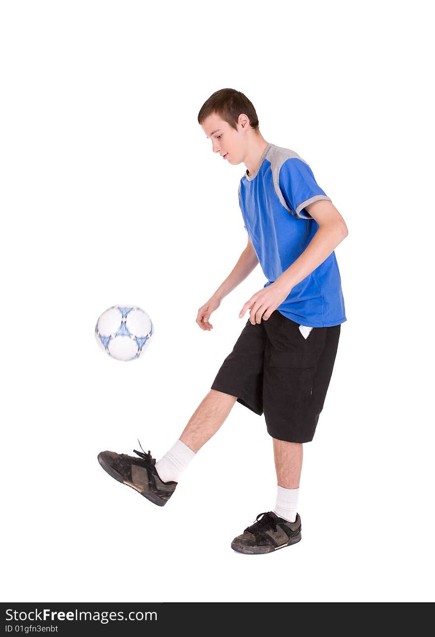 Happy teenager playing football. over white background. Happy teenager playing football. over white background