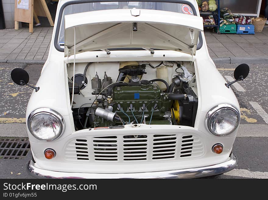 The engine of a classic mini motor car. The engine of a classic mini motor car