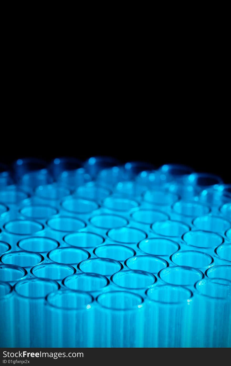 Close-up Of Empty Glass Test Tubes In Blue