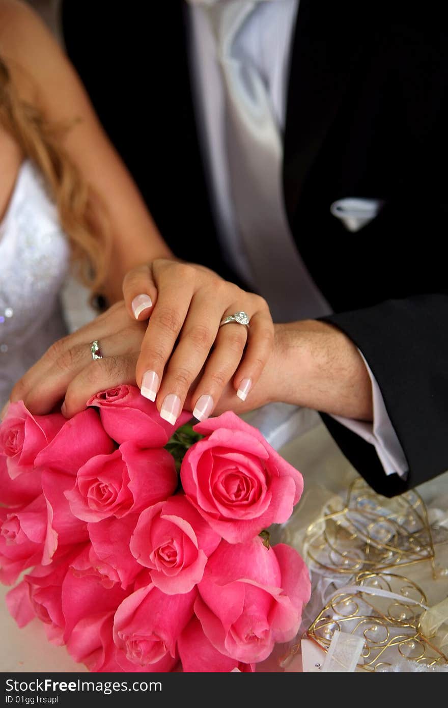 Bride & Groom wearing wedding rings